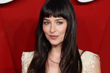 Dakota Johnson is a red-carpet vixen in underwear-exposing lace dress with plunging neckline
