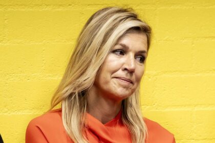 Queen Máxima moved by soccer players’ emotional stories during colorful stadium appearance