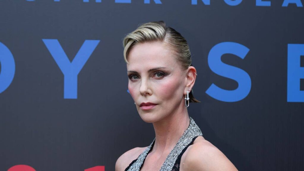 Charlize Theron, 50, steals the show in plunging lace gown and $50k jewels