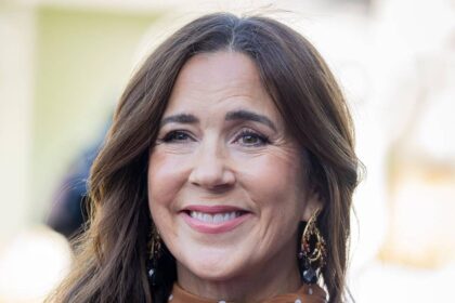 Queen Mary, 54, is effortlessly elegant in waist-cinching polka-dot dress