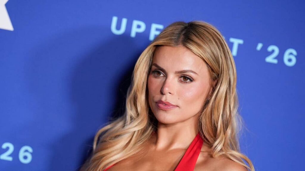Brooks Nader turns heads in daring plunging red dress during glamorous Capri getaway