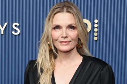 Michelle Pfeiffer stuns in slinky gown and larger-than-life hoops with age-defying appearance