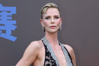 Charlize Theron unveils dramatic new look with edgy baby bangs and daring sheer gown
