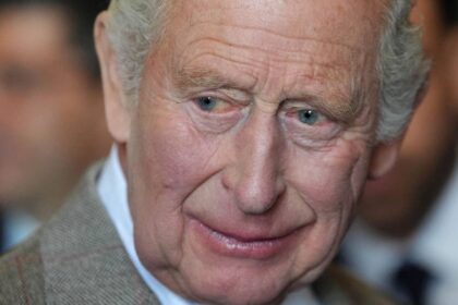 King Charles pictured using unusual walking stick to keep his balance