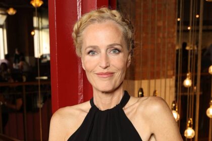 Gillian Anderson, 58, displays incredibly toned arms in sleek black gown on red carpet