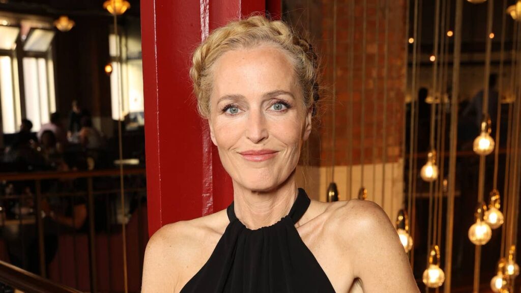 Gillian Anderson, 58, displays incredibly toned arms in sleek black gown on red carpet