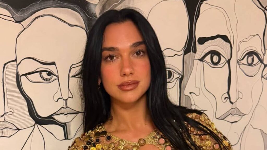 Dua Lipa stuns in gold plunging top at family wedding