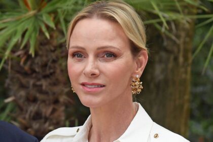 Princess Charlene stands out from the crowd in head-to-toe white for major Palace gathering