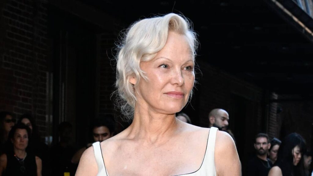 Pamela Anderson stuns in bridal figure-hugging gown