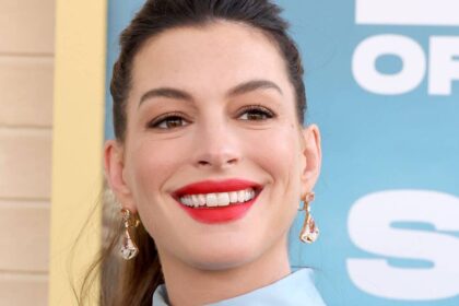 Anne Hathaway bares growing baby bump in daring look after baby confession