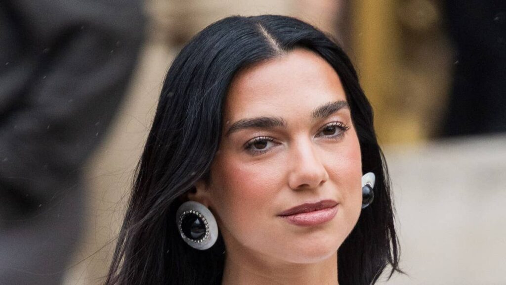 Dua Lipa exposes lace bra in ultimate naked dress with feathers