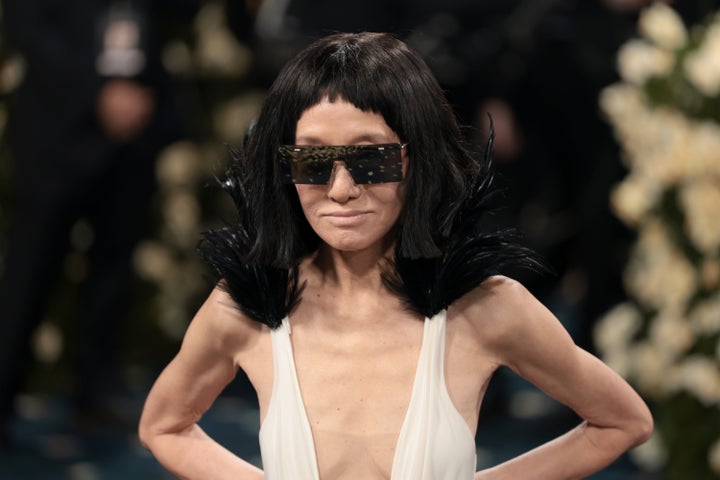 The legendary designer debuted a new shorter hairstyle with baby bangs, while keeping her eyes cooly hidden behind a pair of dark sunglasses.