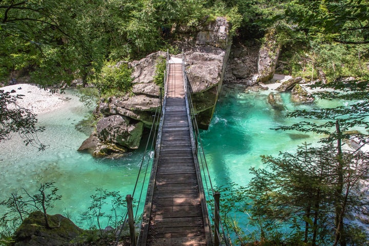 The Soca River in Slovenia, a popular travel destination for outdoor enthusiasts and nature lovers.