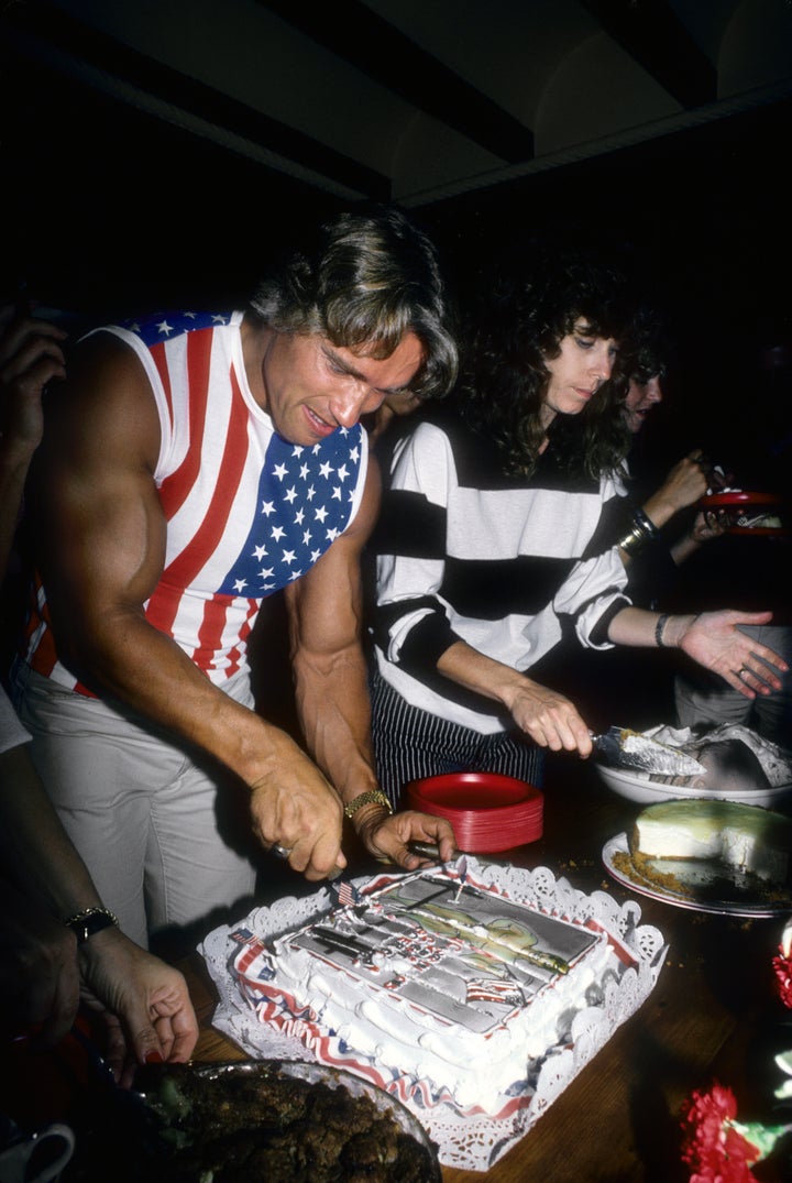 Schwarzenegger cuts the cake at a party to celebrate his becoming a U.S. citizen in 1983.