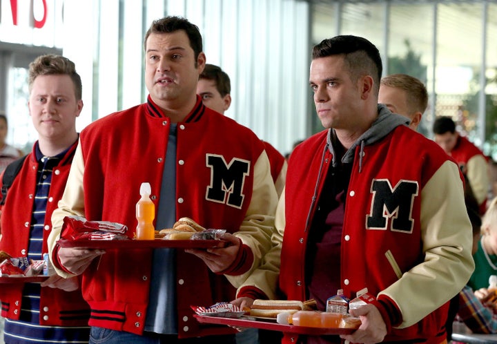 Dave played by Max Adler (center) and Puck played by Mark Salling (right) make fun of Kurt and Rachel on "Glee."